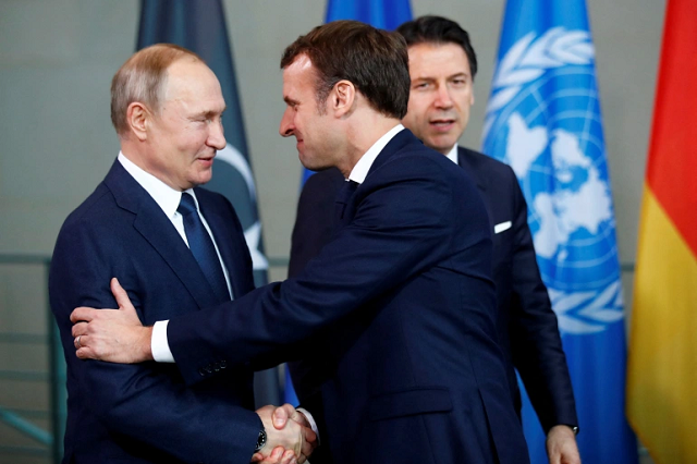 russian president vladimir putin shakes hands with french president emmanuel macron during the libya summit in berlin germany january 19 2020 photo reuters russian president vladimir putin shakes hands with french president emmanuel macron during the libya summit in berlin germany january 19 2020 photo reuters