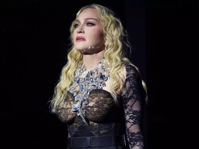 madonna sued by fan over deceptive concert promises photo wire images