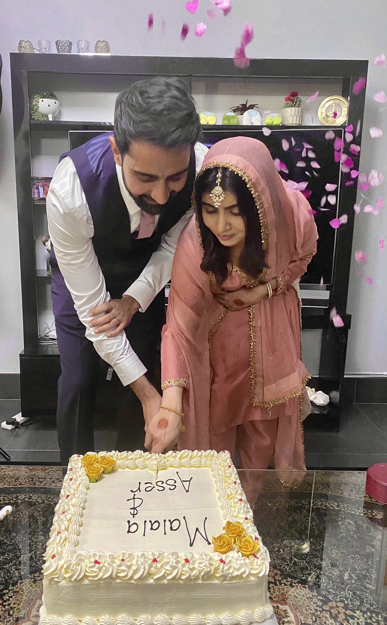 asser malik the lucky man who tied the knot with pakistan s youngest nobel prize winner shares an image of the couple cutting a cake at their nikkah reception in birmingham on his twitter handle photo twitter malikasser