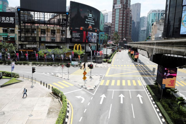 general view of a deserted street during a lockdown due to the coronavirus disease covid 19 pandemic in kuala lumpur malaysia may 11 2021 photo reuters file general view of a deserted street during a lockdown due to the coronavirus disease covid 19 pandemic in kuala lumpur malaysia may 11 2021 photo reuters file