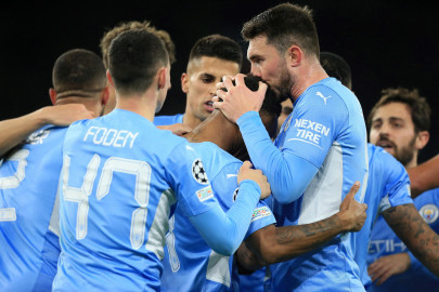 man city close to last 16 place after brugge rout