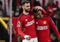 hanging on manchester united s amad diallo r celebrates with bruno fernandes photo afp