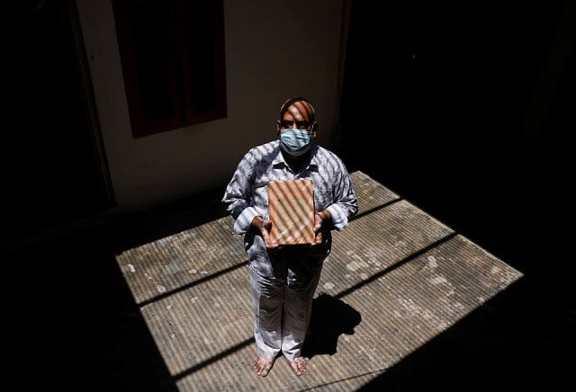 akhilesh agarwal 49 husband of suman lata 50 a teacher who died from the coronavirus disease covid 19 after she attended her local election duty in april shows a religious book of his wife inside their house in the town of vrindavan in the northern state of uttar pradesh india may 25 2021 photo reuters akhilesh agarwal 49 husband of suman lata 50 a teacher who died from the coronavirus disease covid 19 after she attended her local election duty in april shows a religious book of his wife inside their house in the town of vrindavan in the northern state of uttar pradesh india may 25 2021 photo reuters