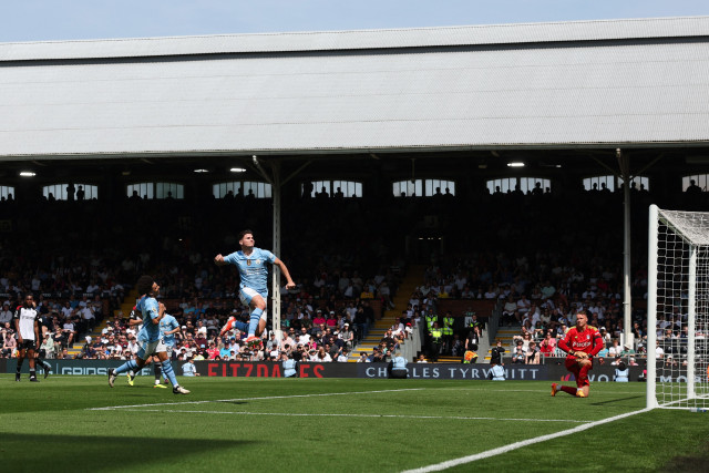 on a high manchester city s striker julian alvarez celebrates scoring the team s fourth goal from the penalty spot against fulham photo afp on a high manchester city s striker julian alvarez celebrates scoring the team s fourth goal from the penalty spot against fulham photo afp