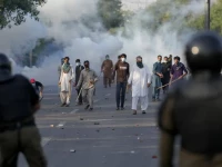 supporters of pakistan tehreek e insaf pti throw stones after police fire tear gas to disperse them in lahore on may 9 2023 photo reuters file