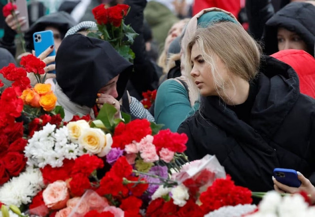 russia mourns victims of deadly concert hall attack putin promises punishment