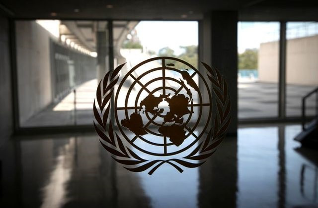 the united nations logo is seen on a window in an empty hallway at united nations headquarters during the 75th annual u n general assembly high level debate which is being held mostly virtually due to the coronavirus disease covid 19 pandemic in new york us september 21 2020 photo reuters