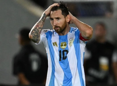 argentina s lead slips away in rain delayed clash after messi s international return