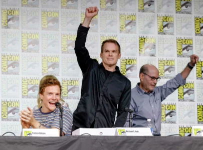 michael c hall makes surprise appearance at comic con for dexter prequel and sequel announcements