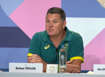 australian swim coach avoids being kicked out of olympics