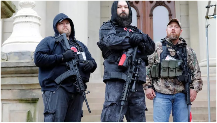 michael null l one of those arrested in the plot to kidnap michigan governor gretchen whitmer at an april 2020 rally against covid 19 restrictions photo afp