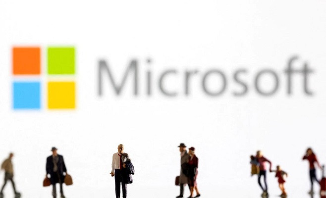 small figurines are seen in front of displayed microsoft logo in this illustration taken february 11 2022 photo reuters