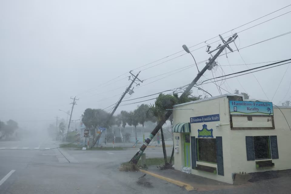 broken utility poles downed by strong wind gusts are seen as hurricane milton approaches fort myers florida us on october 9 2024 photo reuters