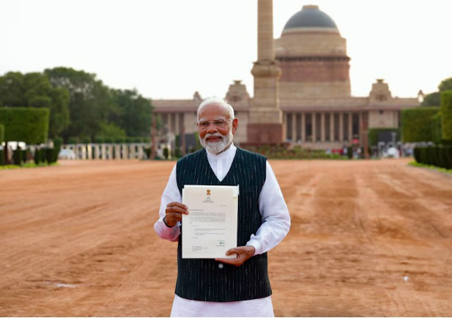 india s prime minister narendra modi shows media a letter that he received from india s president droupadi murmu inviting him to form a new government after meeting her at the presidential palace in new delhi india june 7 2024 photo reuters