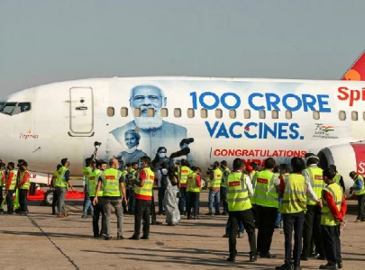 indian man fined for wanting modi s face cut from vaccine drive