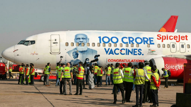 modi s face has been plastered on billboards and even the side of passenger planes alongside a triumphant message celebrating india s recent milestone of one billion administered vaccination doses photo afp file