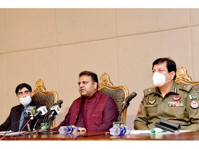 national security adviser dr moeed yousaf left information minister fawad chaudhry and punjab police ig inam ghani photo express national security adviser dr moeed yousaf left information minister fawad chaudhry and punjab police ig inam ghani photo express