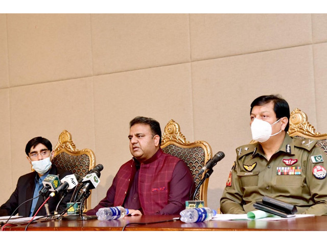 national security adviser dr moeed yousaf left information minister fawad chaudhry and punjab police ig inam ghani photo express