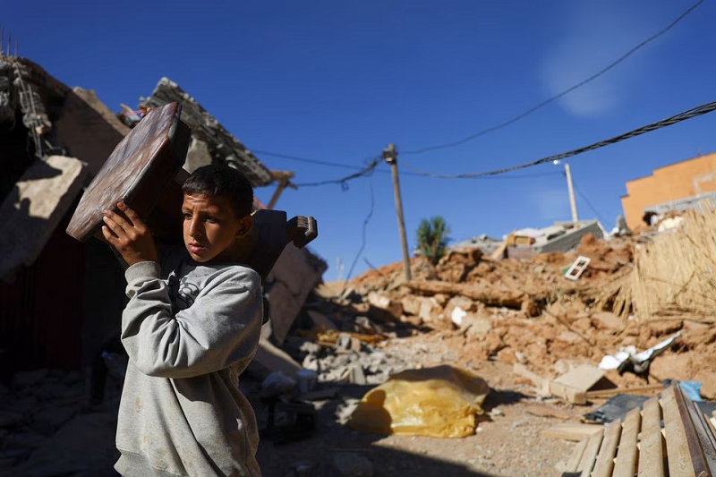 a person carries an item of furniture in the aftermath of a deadly earthquake in a hamlet on the outskirts of talat n yaaqoub morocco september 11 photo reuters