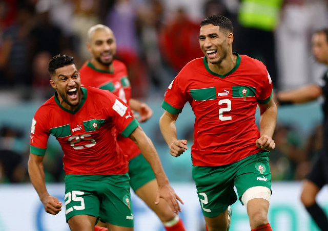 morocco s achraf hakimi celebrates after scoring the winning penalty during the penalty shootout as morocco progress to the quarter finals december 6 2022 photo reuters