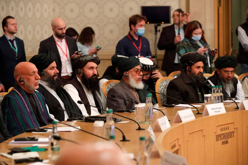 officials including afghan former president hamid karzai and the taliban s deputy leader and negotiator mullah abdul ghani baradar attend the afghan peace conference in moscow russia march 18 2021 photo reuters