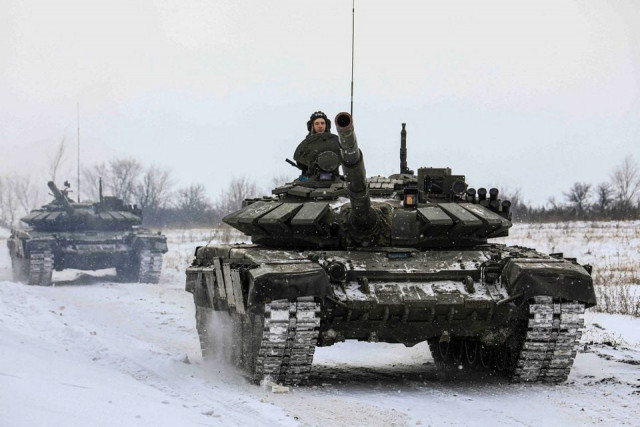 russian servicemen drive tanks during military exercises in the leningrad region russia in this handout picture released february 14 2022 russian defence ministry handout via reuters file photo russian servicemen drive tanks during military exercises in the leningrad region russia in this handout picture released february 14 2022 russian defence ministry handout via reuters file photo