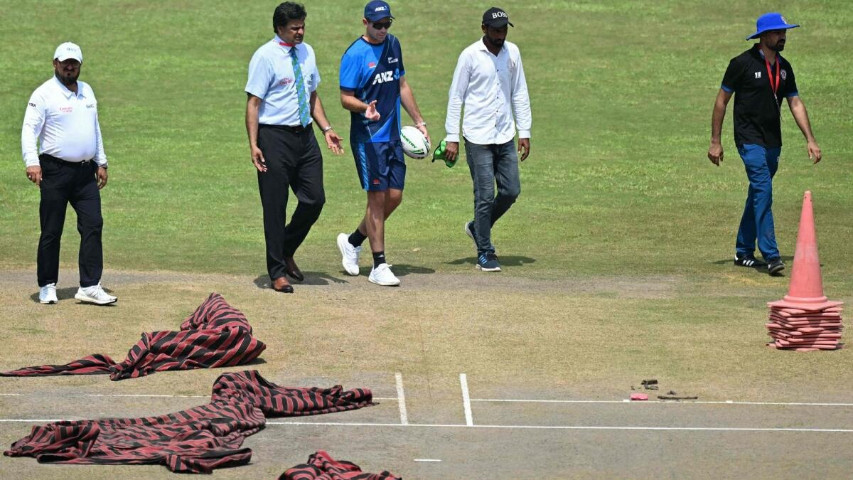 head coaches brendon mccullum and jason gillespie inspect the multan pitch condemned as a road during the first test between england and pakistan photo afp