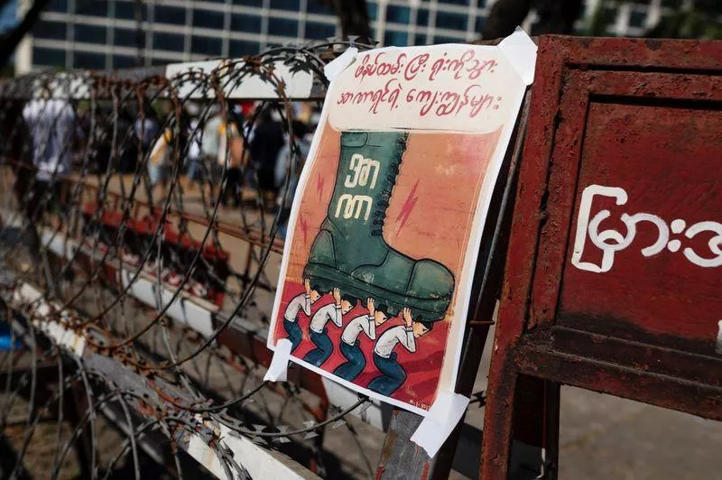 a placard is displayed outside the central bank of myanmar during a protest against the military coup and to demand the release of elected leader aung san suu kyi in yangon myanmar february 11 2021 photo reuters a placard is displayed outside the central bank of myanmar during a protest against the military coup and to demand the release of elected leader aung san suu kyi in yangon myanmar february 11 2021 photo reuters