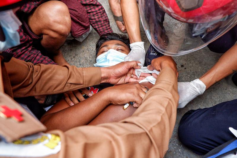 a injured man lies on the ground after the police fired rubber bullets during protests against the military coup in mandalay myanmar february 20 2021 photo reuters