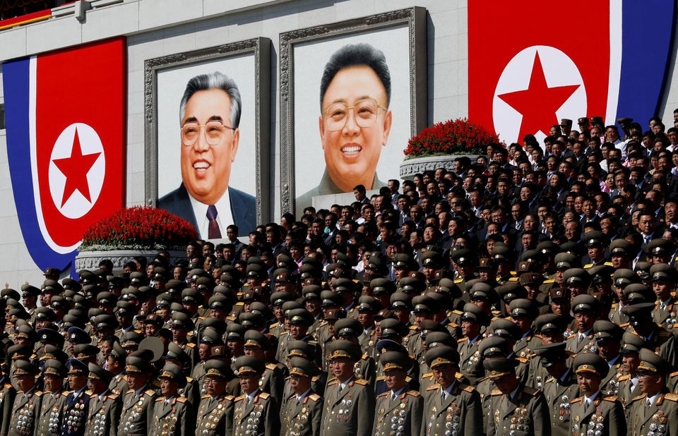 senior military officials watch a parade as portraits of late north korean leaders kim il sung and kim jong il are seen in the background at the main kim il sung square in pyongyang north korea september 9 2018 photo reuters