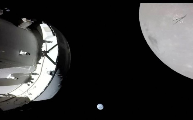 a camera on orion s solar array wing captures a view of the spacecraft the earth and the moon during the spacecraft s outbound powered flyby of the moon as part of the artemis i mission november 21 2022 in a still image from video artemis i the first flight test of nasa s orion capsule and space launch system rocket launched november 16 2022 photo reuters a camera on orion s solar array wing captures a view of the spacecraft the earth and the moon during the spacecraft s outbound powered flyby of the moon as part of the artemis i mission november 21 2022 in a still image from video artemis i the first flight test of nasa s orion capsule and space launch system rocket launched november 16 2022 photo reuters