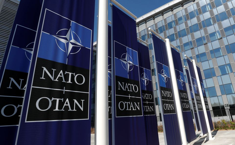 banners displaying the nato logo are placed at the entrance of new nato headquarters during the move to the new building in brussels belgium april 19 2018 photo reuters