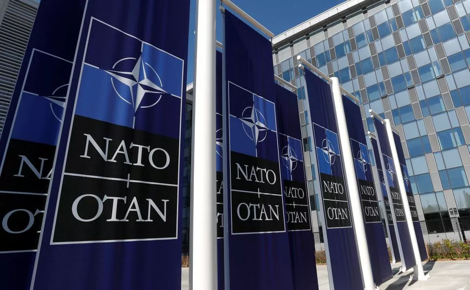 banners displaying the nato logo are placed at the entrance of new nato headquarters during the move to the new building in brussels belgium april 19 2018 photo reuters banners displaying the nato logo are placed at the entrance of new nato headquarters during the move to the new building in brussels belgium april 19 2018 photo reuters
