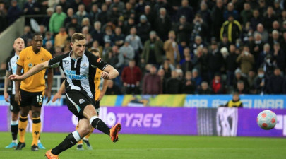 wood s penalty takes newcastle nearer survival