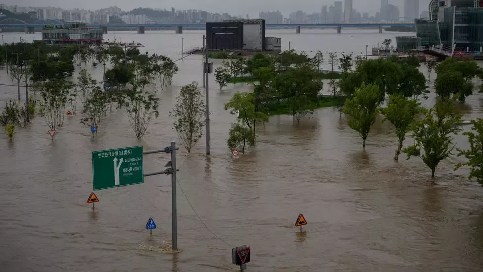 the han river burst its banks in some places causing flooding photo afp the han river burst its banks in some places causing flooding photo afp