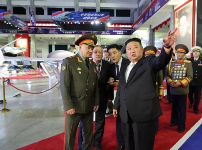 north korea s kim shows off banned missiles to russian minister north korea s kim shows off banned missiles to russian minister