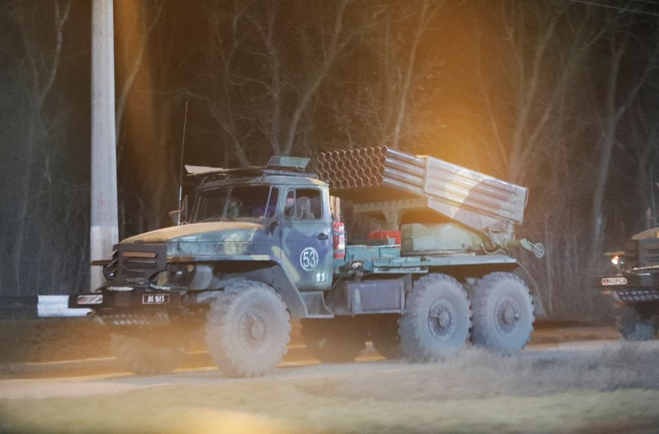 A military vehicle is seen on a street on the outskirts of the separatist-controlled city of Donetsk, Ukraine February 24, 2022. REUTERS