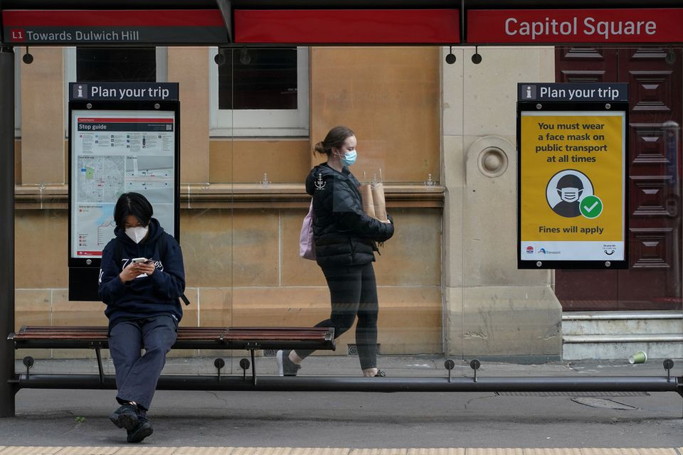 people wear protective face masks in the city centre during a lockdown to curb the spread of a coronavirus disease covid 19 outbreak in sydney australia september 28 2021 photo reuters