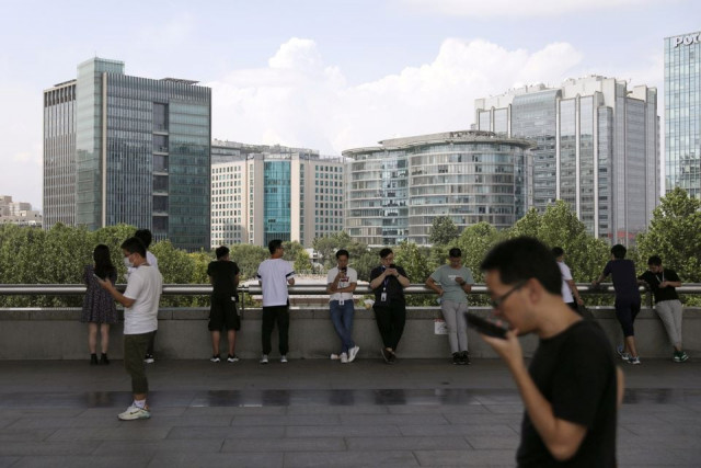 people are seen at beijing s tech hub zhongguancun china august 23 2021 reuters tingshu wang people are seen at beijing s tech hub zhongguancun china august 23 2021 reuters tingshu wang