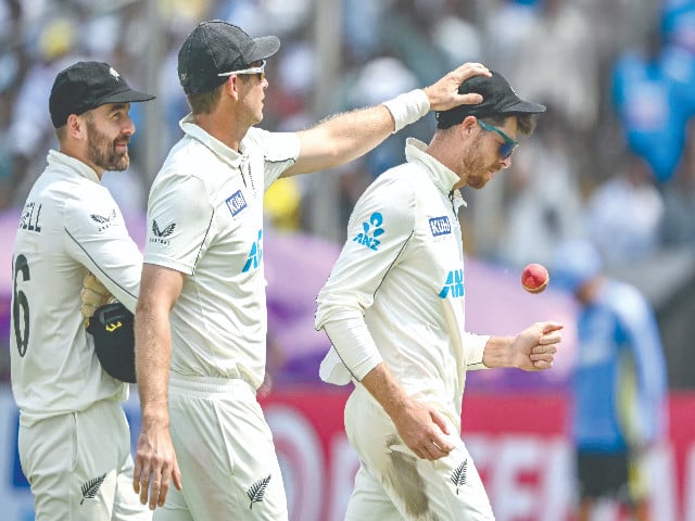 new zealand s mitchell santner r is being greeted by his teammates after his magnificent 7 for 53 against india on second day of the second test in pune photo afp