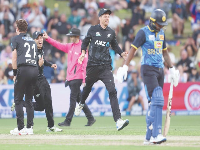 new zealand s mitchell santner c celebrates after running out sri lanka s charith asalanka in the second odi at hamilton on wednesday photo afp