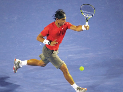 nadal powers through local teen to reach last 16