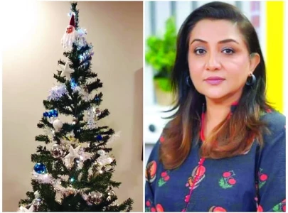 nadia proudly displays christmas tree at home
