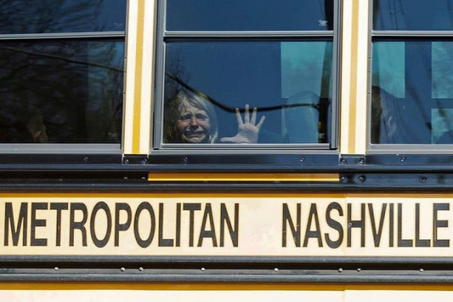 a child weeps while on the bus leaving the covenant school following a mass shooting at the school in nashville tennessee u s march 27 2023 photo reuters