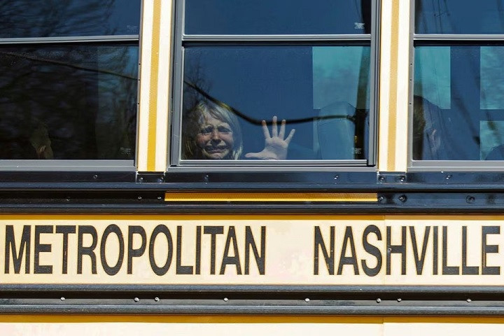 a child weeps while on the bus leaving the covenant school following a mass shooting at the school in nashville tennessee u s march 27 2023 photo reuters