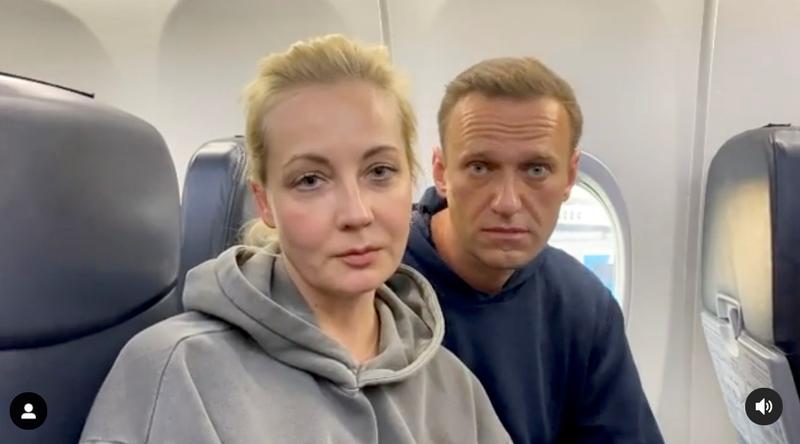 russian opposition politician alexei navalny and his wife yulia are seen in a still image from video on board of a plane before the departure for moscow at an airport in berlin germany january 17 2021 in this still image from video obtained from social media photo reuters