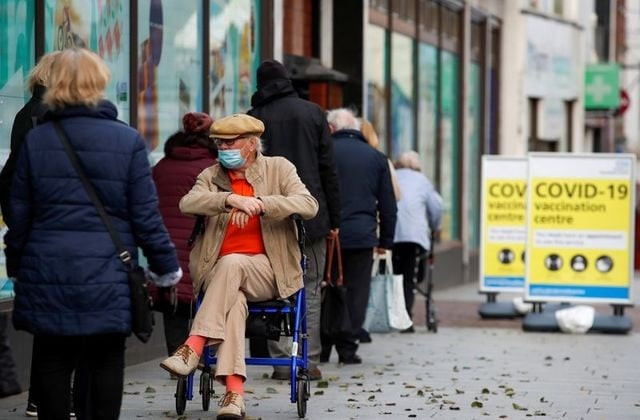 people queue to receive the coronavirus disease covid 19 vaccine outside a closed down debenhams store that is being used as a vaccination centre in folkestone kent britain january 28 2021 photo reuters