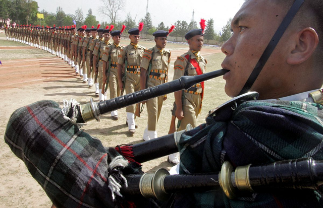 a band member from the gurkha regiment of indian army plays a musical instrument during the passing out parade ceremony of indo tibetan border police in the northern indian city of chandigarh april 25 2008 photo reuters