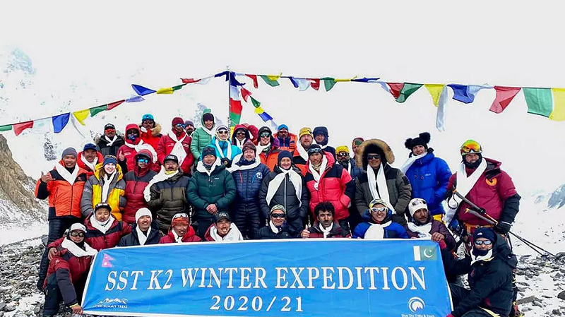 this handout photo taken on january 16 2021 by seven summit treks shows the historic team of 10 nepali mountaineers and sherpas after reaching the summit of k2 photo afp