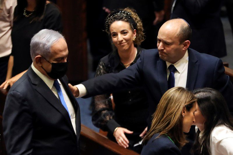 head of opposition benjamin netanyahu and israel prime minister naftali bennett gesture following the vote on the new coalition at the knesset israel s parliament in jerusalem june 13 2021 photo reuters